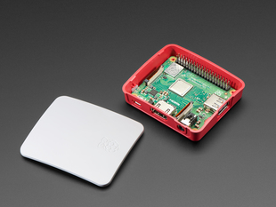 Half-assembled Raspberry Pi Model 3 A+ case with the lid next to the bottom piece.
