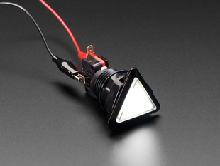 Angled shot of a white triangle illuminated LED pushbutton. 