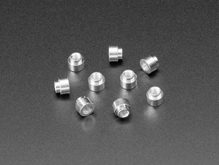 Angled shot of ten 3mm tall M3 standoff nuts.