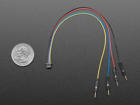 Top view of JST SH 4-pin to Premium Male Headers Cable next to US quarter for scale. 