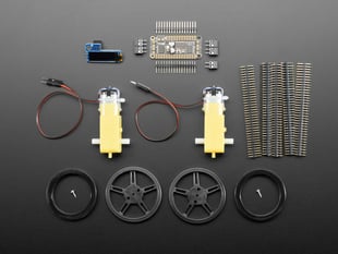 Kit component shot with wheels, motors and other hardware.