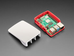 Partially assembled Red and whit Raspberry Pi Foundation Raspberry Pi 4 Case. 