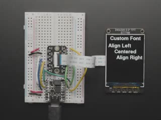 Overhead video of TFT display running boot-up animation.