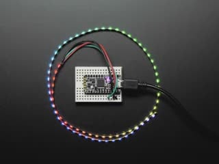 Curved NeoPixel LED strip wired to arduino, with each LED changing to a different color in the rainbow