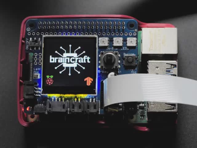 Video of a white hand hovering a coffe mug over a Adafruit BrainCraft HAT thats connected to a Raspberry Pi 4. Display detects that its a coffee mug. 