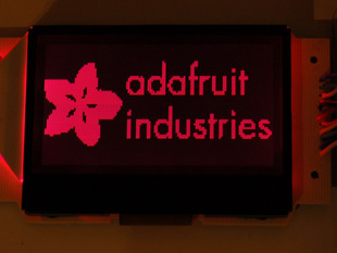 Graphic LCD showing Adafruit logo with red backlight