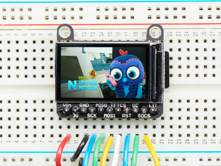 TFT breakout wired up on breadboard, showing colorful image of friendly owl