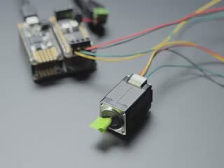 video of a mini stepper motor rotating with a piece of green paper on the 