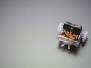Small two-wheeled robot turning around in a circle.