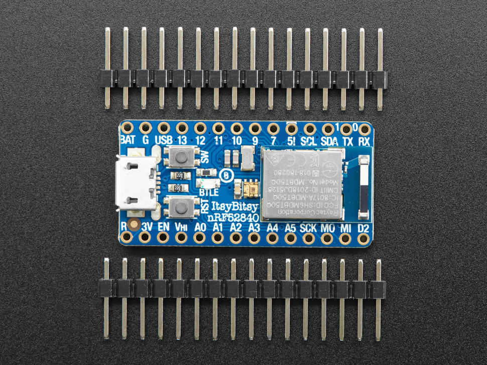 Top view of Adafruit ItsyBitsy nRF52840 Express - Bluetooth LE between 2 16-pin headers.