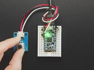 Video of a white hand turning the knob on a STEMMA Wired Potentiometer Breakout Board connect to a breadboard. Color changes when the knob is twisted. 