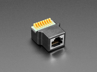 Angled shot of RJ-45 Ethernet Female Socket to Terminal Spring Block Adapter.