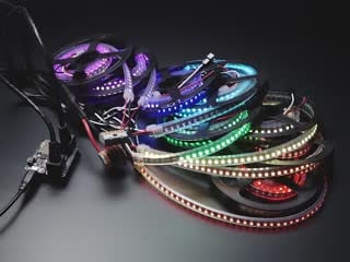 8 LED strips in various colors connected to a FeatherWing M4.