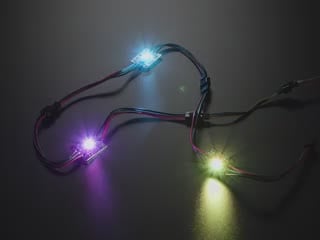 Three Ultra Bright 3 Watt Chainable NeoPixel LEDs glowing rainbow