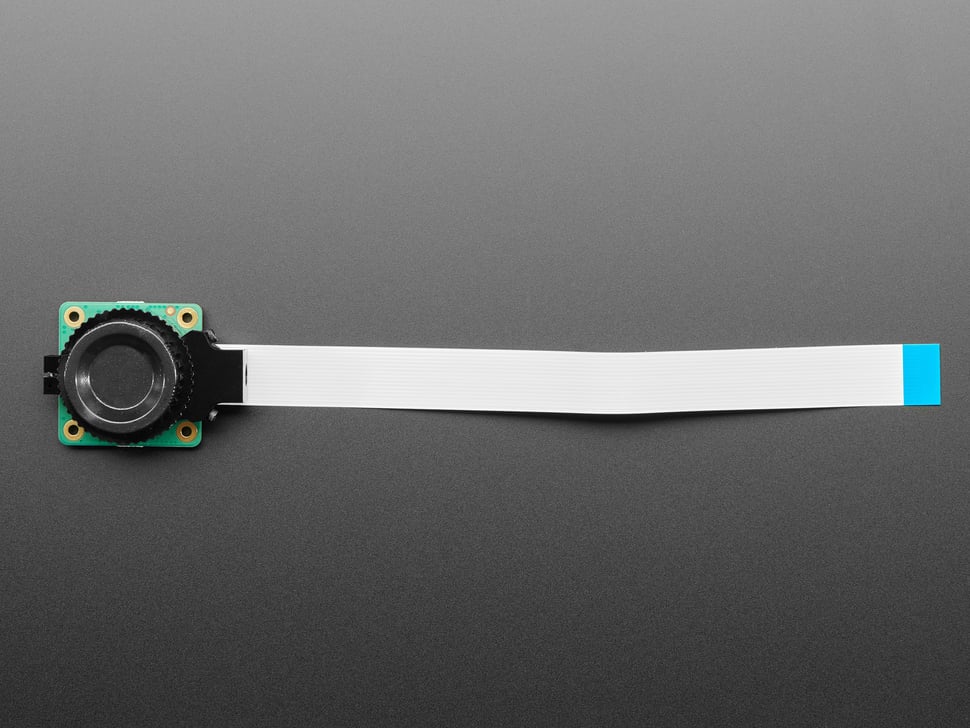 Top view of camera module connected to FPC ribbon cable.