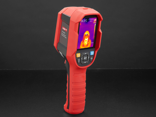 Thermal camera displaying a thermal image on it's lcd screen. Camera is red and grey, with the screen at the top of the camera and a handle at the bottom
