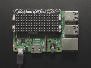 Top down view of Pimoroni Unicorn HAT Mini for Raspberry Pi connected to a Raspberry Pi. 