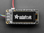 Close up of a Adafruit FeatherWing OLED - 128x64 OLED Add-on For Feather - STEMMA QT / Qwiic. Display reads "adafruit"