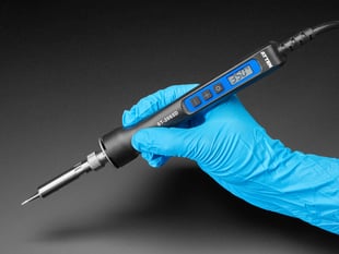 Hand holding Pen type soldering iron with 350 on LCD