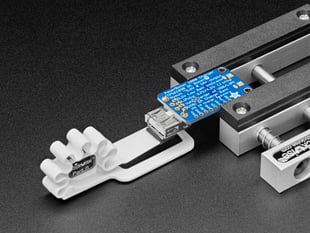Stickvise Part Lifter holding a USB jack onto a PCB