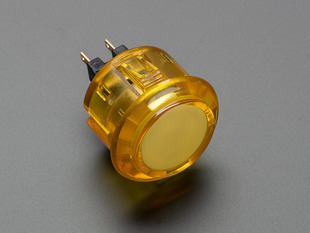 Angled shot of a translucent yellow round 30mm arcade button. 