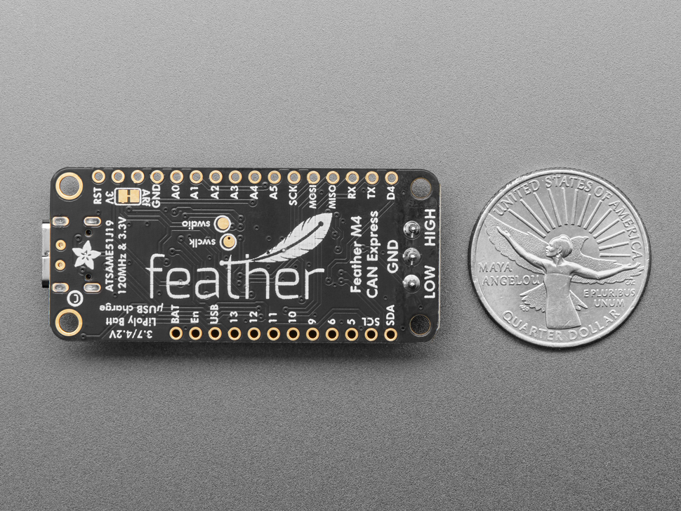 Back view of the Adafruit Feather M4 CAN Express with ATSAME51 next to US quarter for scale. 