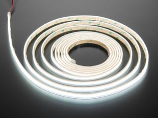 Long coiled LED strip lit up cool white