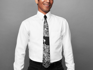 Man wearing black tie with silver circuit board imagery 