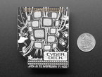 Top-down shot of Cyberdeck HAT PCB next to US quarter
