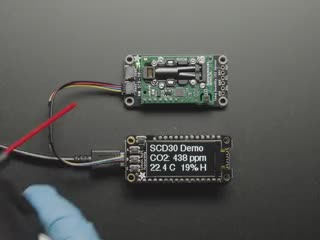 Video of someone blowing a dust on a Adafruit SCD-30 - NDIR CO2 Temperature and Humidity Sensor. 