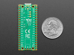 Bottom of PCB with CE and FCC marks, next to US quarter.