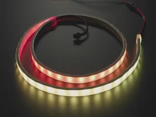 Video of loosely coiled LED strip flashing rainbow colors.