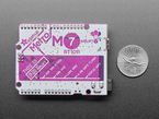 Back shot of Adafruit Metro M7 with AirLift - Featuring NXP iMX RT1011 measured by US quarter. 