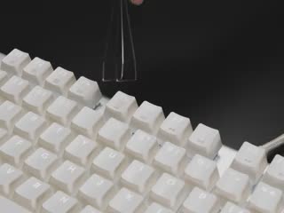 Video of key puller being used to pull out a keycap on a full size keyboard.