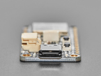 Close-up of USB-C port on rectangular microcontroller.