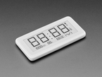 Angled shot of white rectangular digital clock with electronic ink display. It reads 88:88.