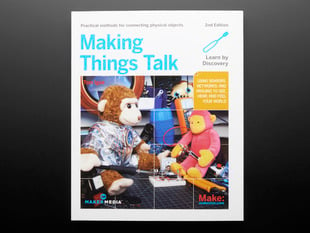 Front cover of "Making Things Talk, Second Edition" By Tom Igoe - 2nd Edition. Cover photograph features two different stuffed monkey toys tinkering with electronics.
