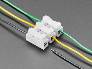 Angled shot of 3 different colored wires plugged into the 3-pin wire joint.