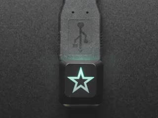 Close-up video of Zener ESP Star keycap glowing rainbow colors.