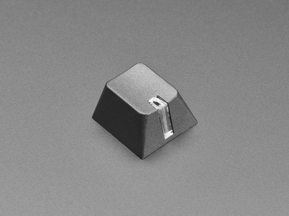 Angled shot of single black 1U R4 lamp keycap.