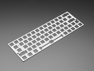 Angled shot of Silver Anodized Metal 60% / GH60 Keyboard Shell Plate.