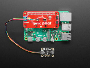 Top view of a Qwiic pHAT installed on a Pi 4 connected to a temperature-humidity sensor.