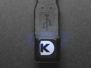 Top view video of a Digi-Key keycap glowing rainbow colors via an Adafruit NeoKey Trinkey NeoPixels.