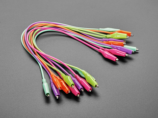 Angled shot of ten 13" long colorful alligator test clips.