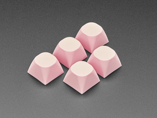 Angled shot of five pink MA keycaps.