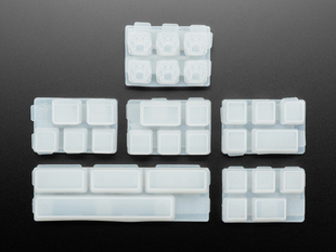 Top view of six different keycap mold sets.