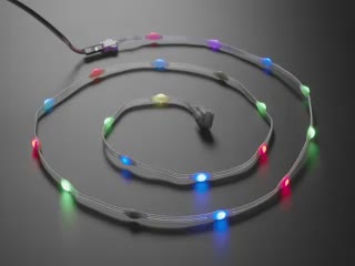 Video of an LED dot strip glowing rainbow colors.