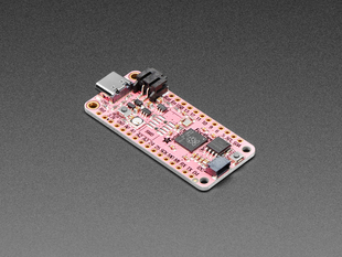 Angled shot of pink rectangular microcontroller.