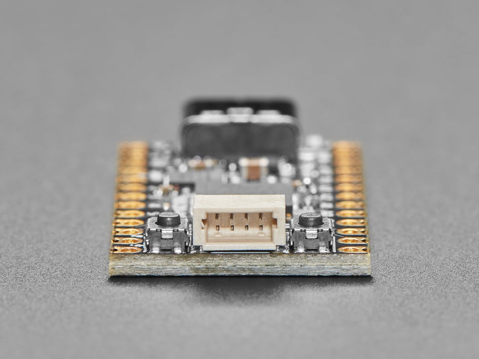 Close-up of JST-SH port on short black microcontroller.
