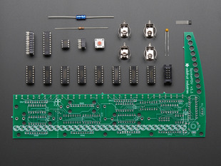 Layed-out collection of all kit components - PCB and loose parts.